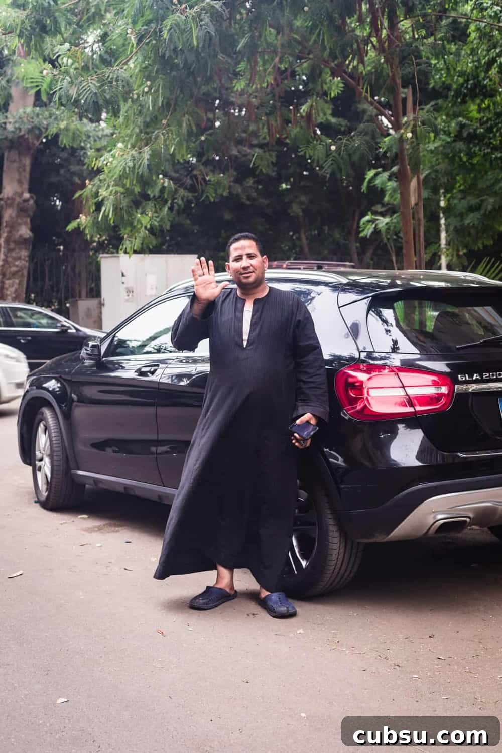 Cairo Adventures: Top Experiences and Hidden Gems to Explore 15 Man wearing high end Egyptian traditional clothing in the Zamalek district of Cairo.