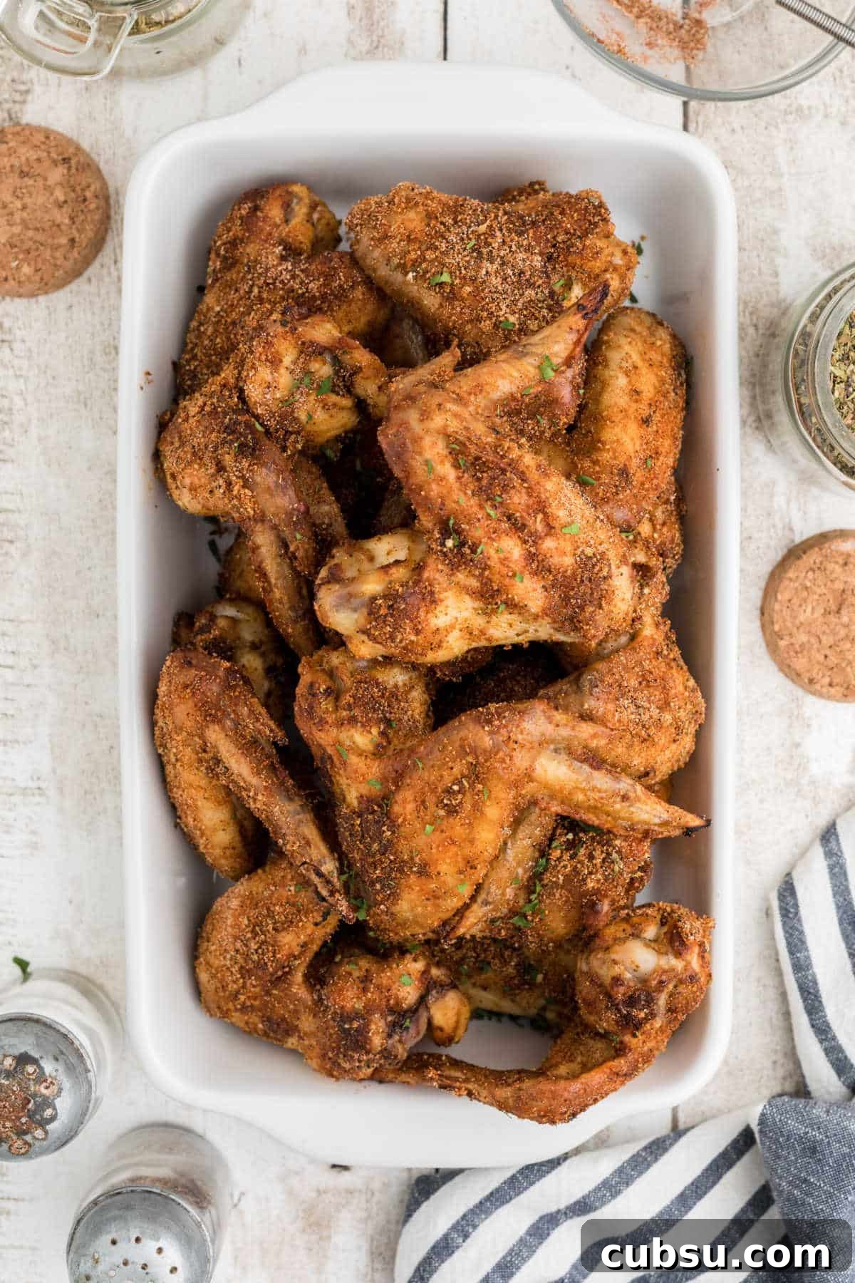 Overhead shot of a dish of wings cooked with Wingstop Louisiana Rub Recipe.