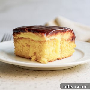 piece of boston cream poke cake on a plate.