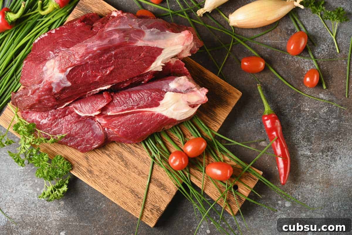 Top Cuts for Homemade Beef Jerky (+Video) 11 Elk Meat on cutting board with spices