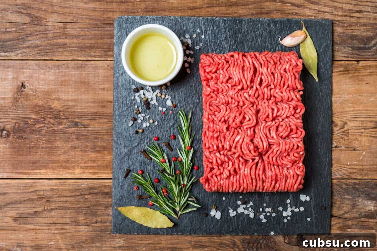 Top Cuts for Homemade Beef Jerky (+Video) 9 Ground meat on slate with spices for beef jerky