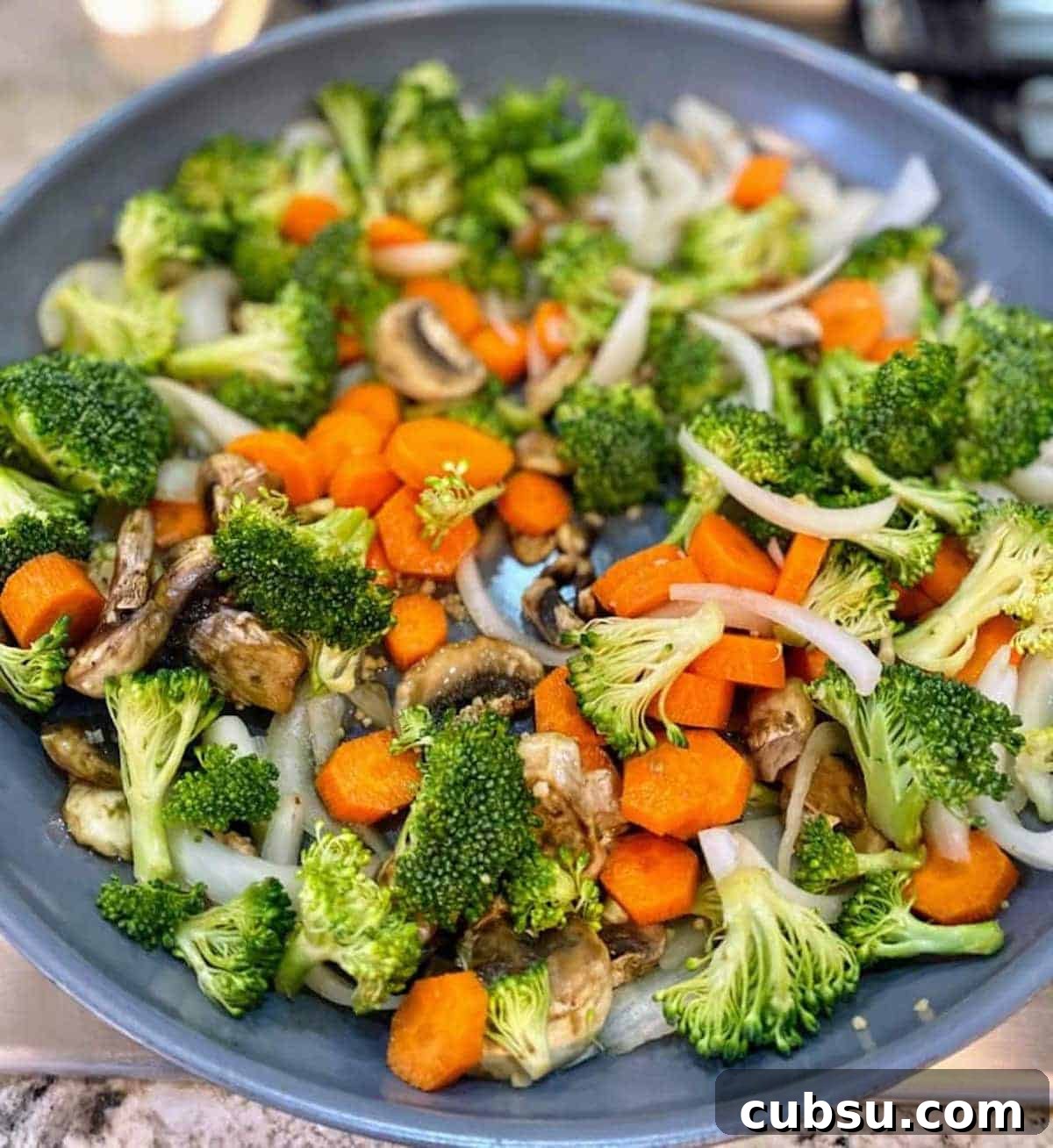 Vegan Pesto Pasta Recipe with Creamy Cashew Sauce 4 I added broccoli and carrots to the skillet on the stove for the vegan pesto pasta recipe.
