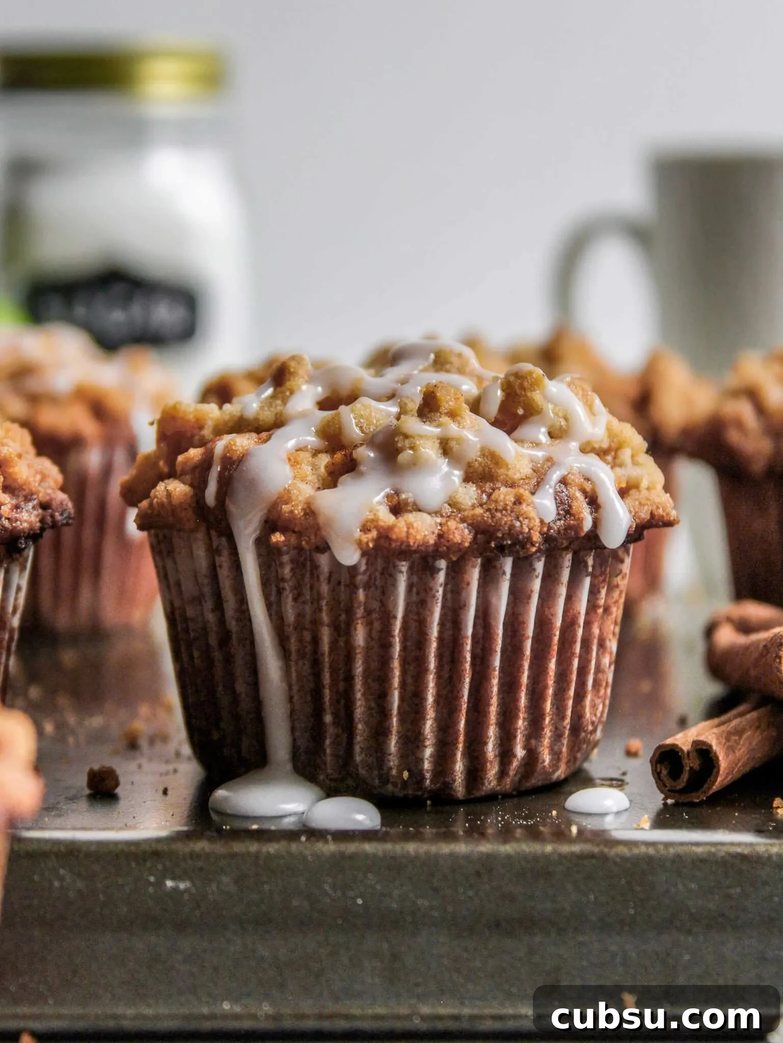 Muffins vs Cupcakes: Key Differences, Taste & Baking Tips 11 iced apple crumb muffins on serving platter (1)