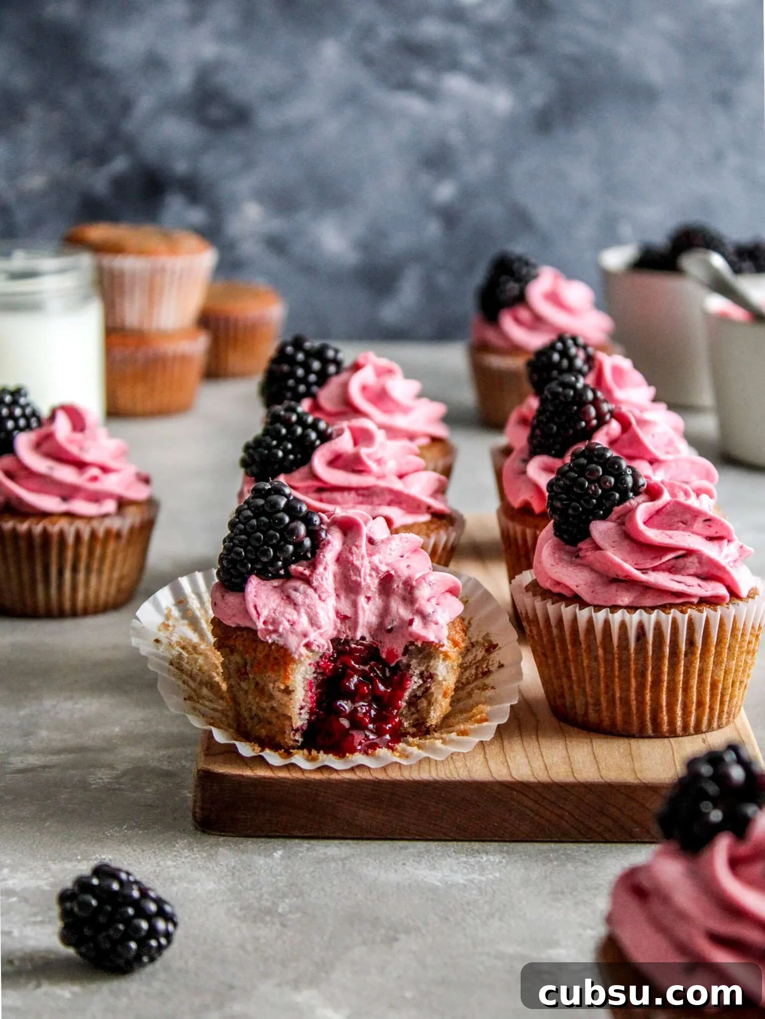 Muffins vs Cupcakes: Key Differences, Taste & Baking Tips 3 frosted blackberry cupcakes on serving platter (1)