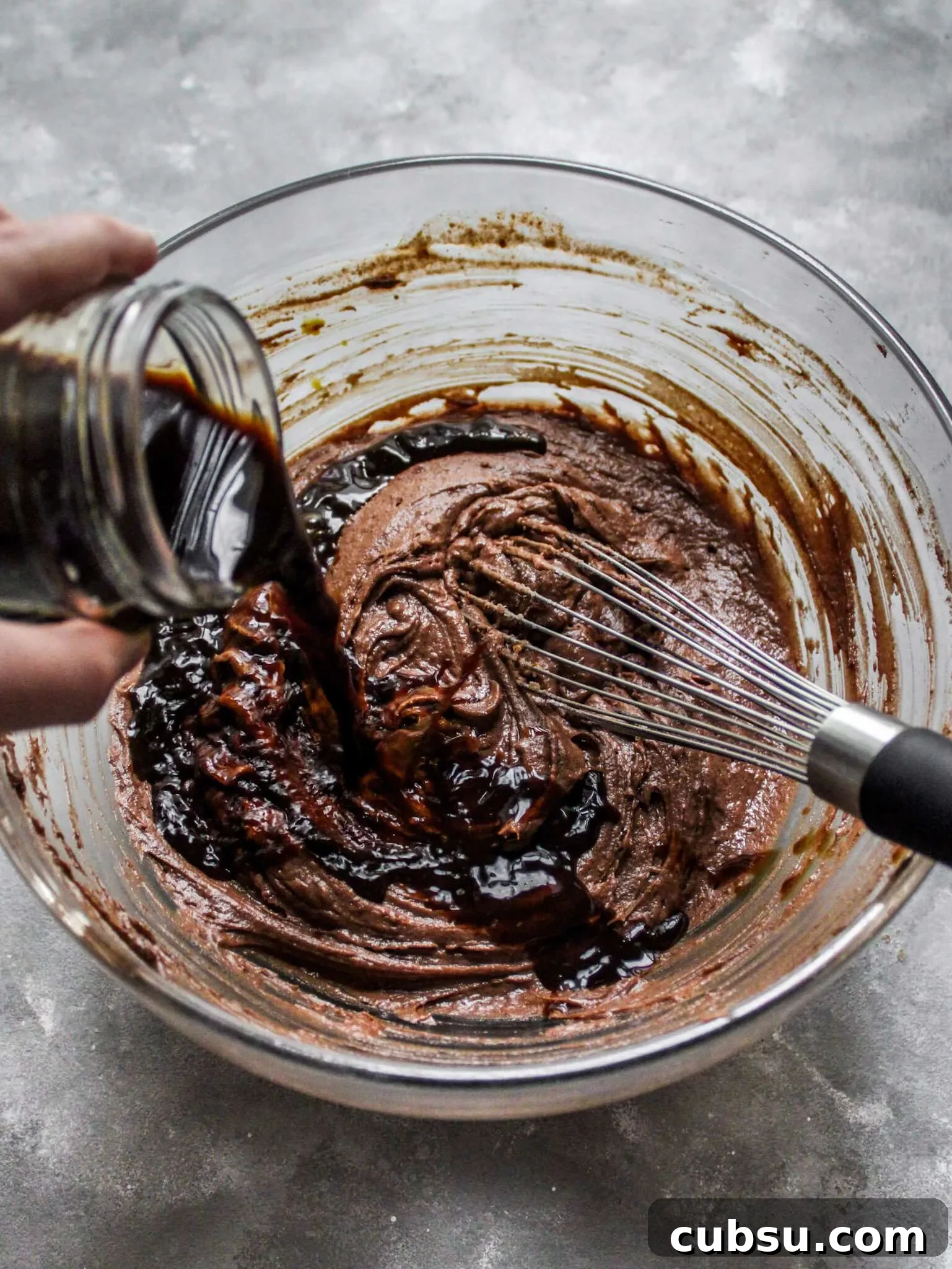 Muffins vs Cupcakes: Key Differences, Taste & Baking Tips 9 chocolate espresso cupcakes pouring coffee into batter