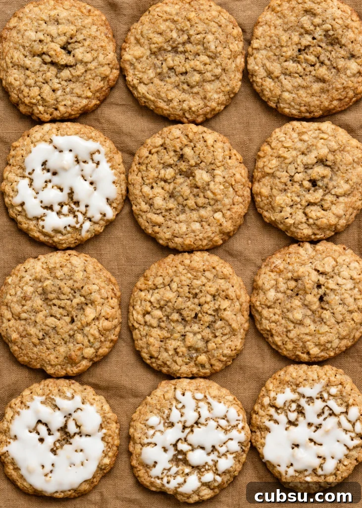 Zesty Lemon Oatmeal Cookies with a Refreshing Iced Glaze 3 Overhead view of plain and iced oatmeal cookies in rows on a linen cloth.