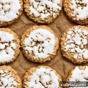 Zesty Lemon Oatmeal Cookies with a Refreshing Iced Glaze 9 Overhead view of iced oatmeal cookies in rows on a linen cloth.