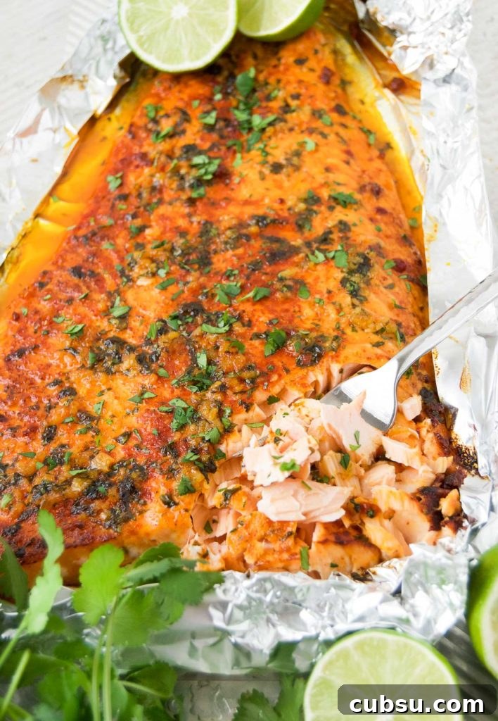 Citrus-Baked Salmon with Lime and Herbs 8 Baked Lime Salmon on a baking sheet with cilantro and lime halves