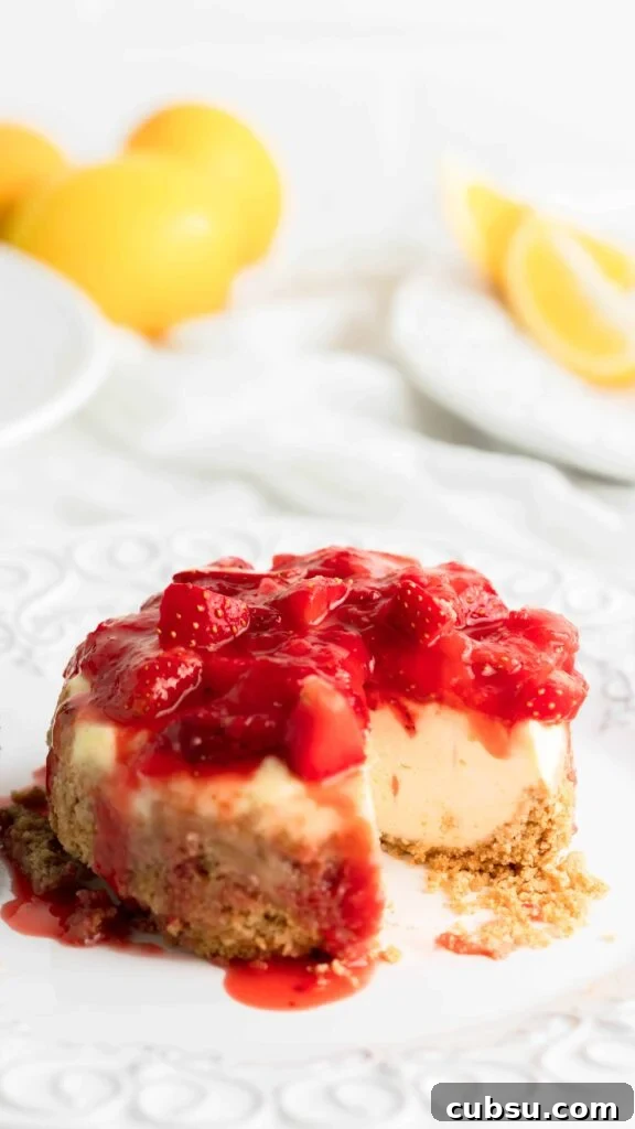Instant Pot Strawberry Cheesecake Recipe — Creamy One-Pot Dessert 4 Slice taken out of Instant Pot Strawberry Cheesecake topped with strawberry ganache.