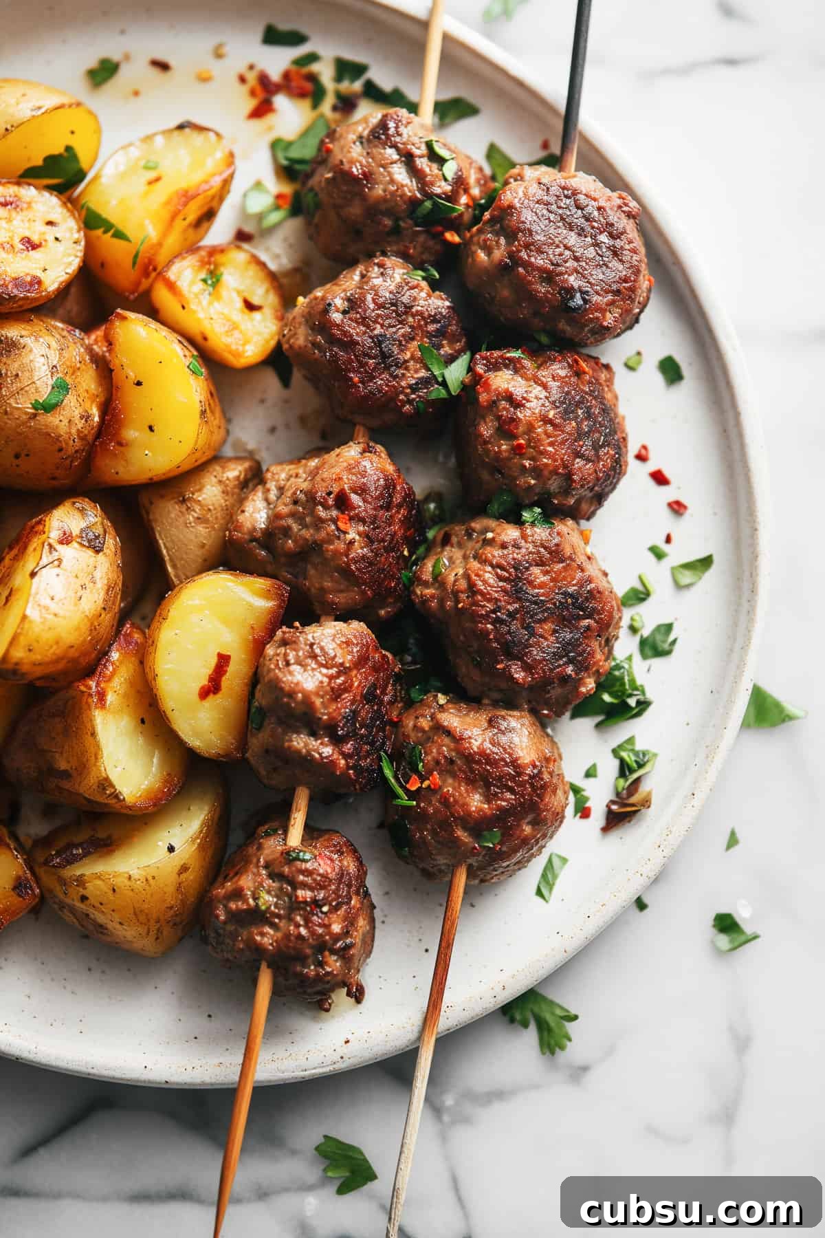 Classic Greek Meatballs Recipe (Keftedes) for Authentic Flavor 2 Traditional Greek meatballs-Keftedes with roast potatoes.