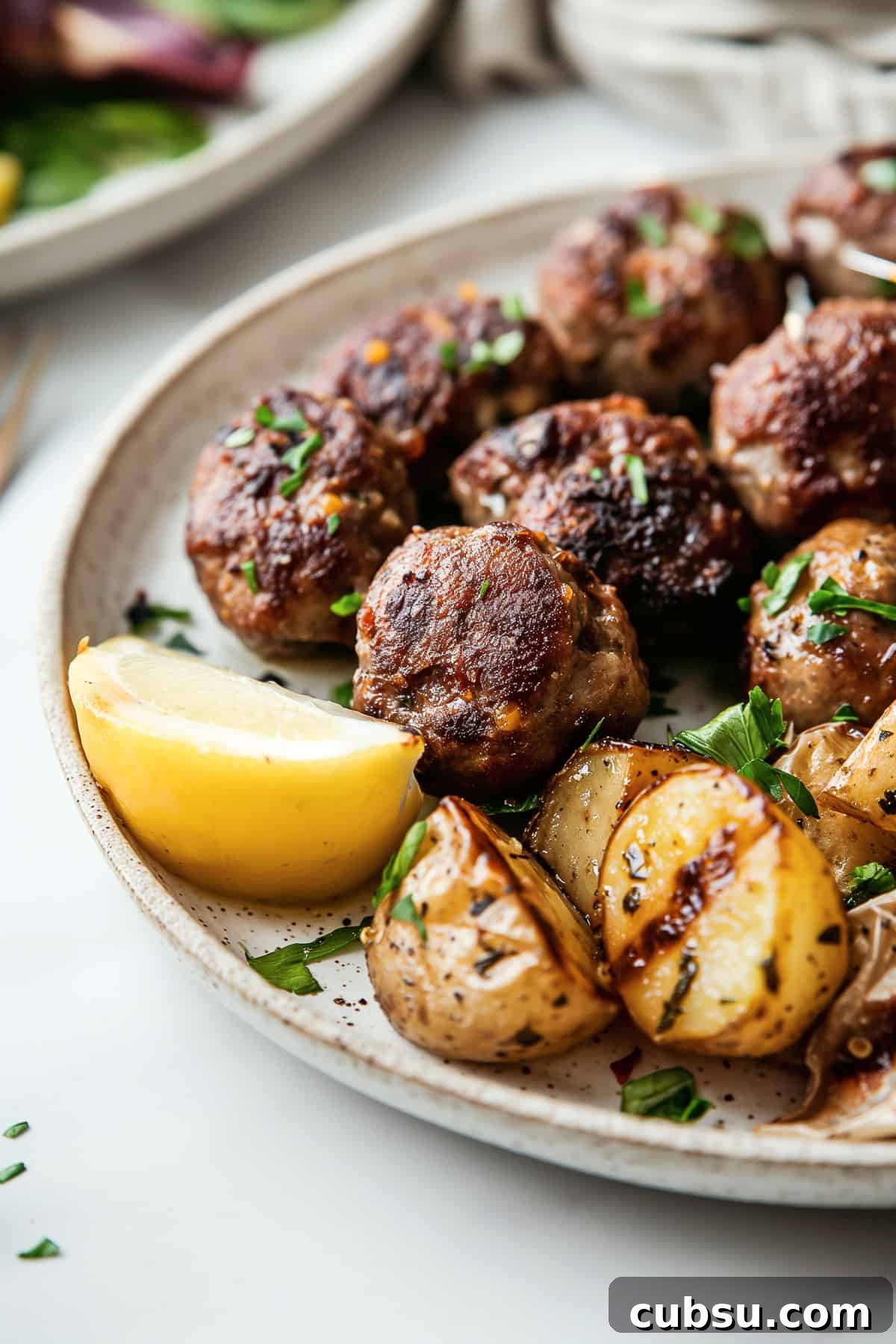 Comforting Greek meatball bowls with roasted lemon garlic potatoes. Traditional Greek meatballs-Keftedes with roast potatoes.