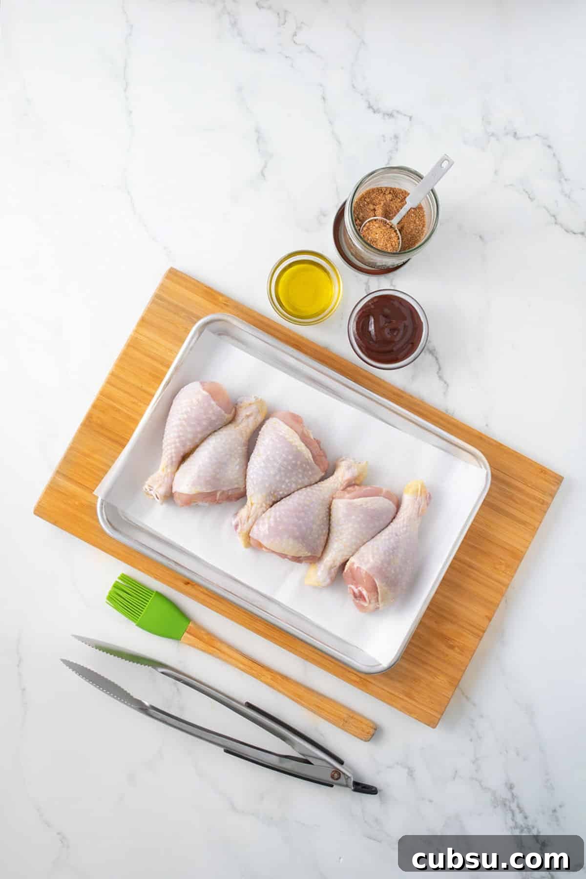 Ingredients on the table to make chicken legs in the smoker.