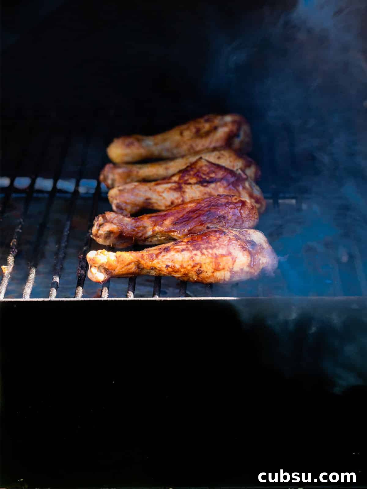 Chicken legs cooking in the smoker.