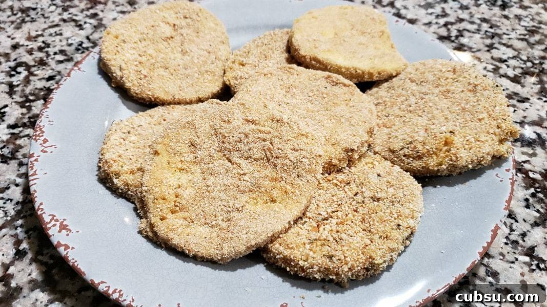 Crispy Oven-Baked Eggplant Parmesan Recipe 6 8 eggplant slices coated in breadcrumbs