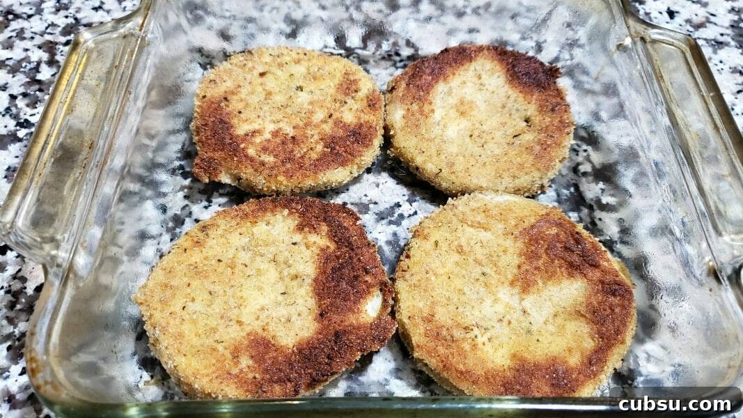 Crispy Oven-Baked Eggplant Parmesan Recipe 8 4 fried eggplant slices in a baking dish