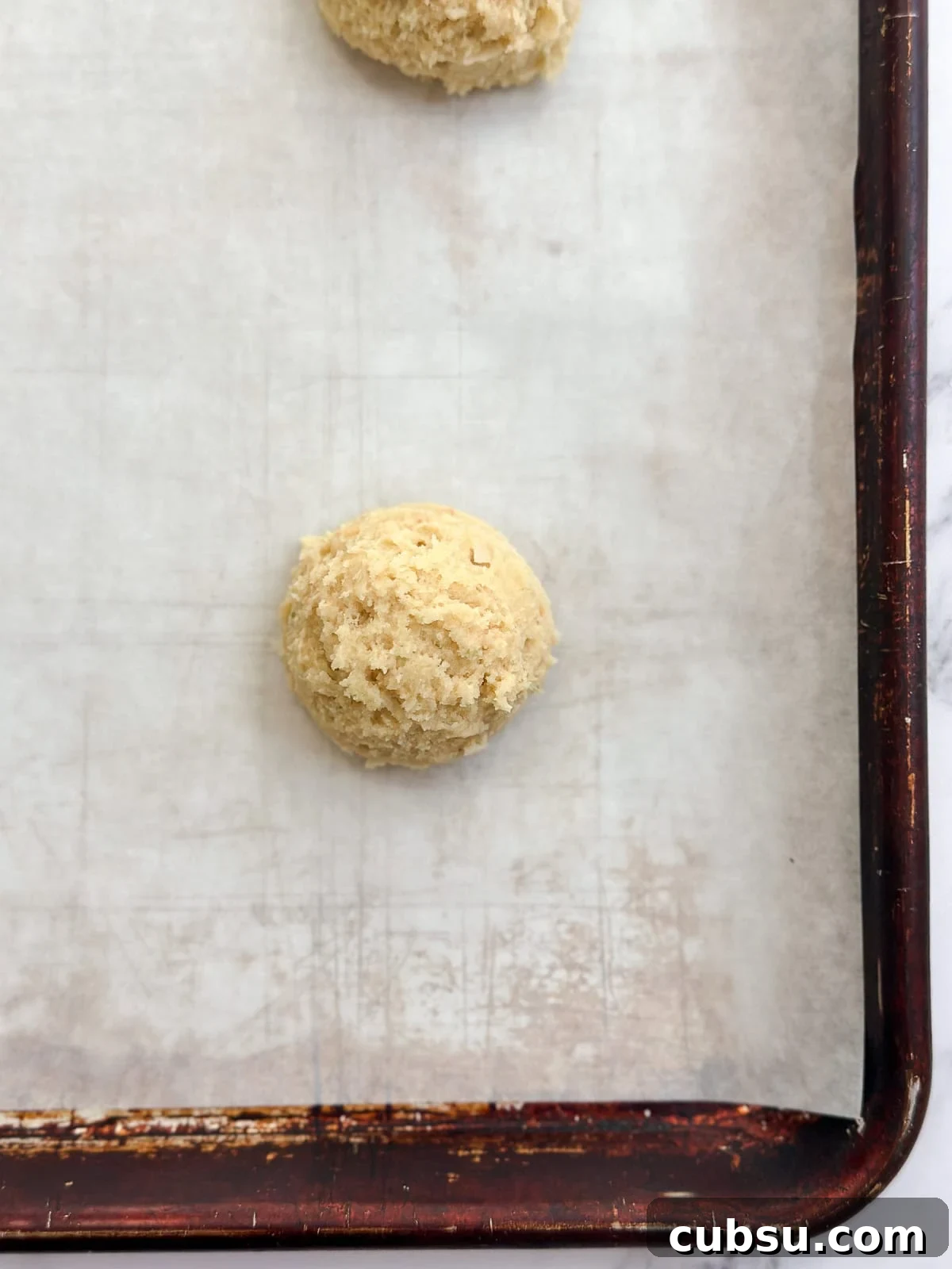 Zesty Lime Coconut Cookies Recipe for Fresh Tropical Flavor 9 cookie dough balls before baking on the cookie sheet.