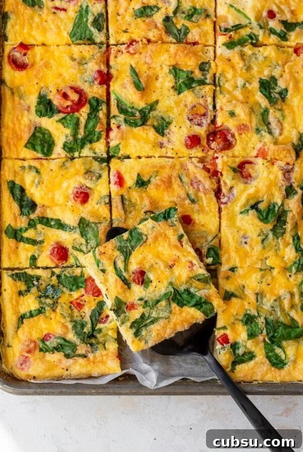Make-Ahead Breakfast Burritos for Busy Mornings 11 overview of sheet pan eggs sliced into squares