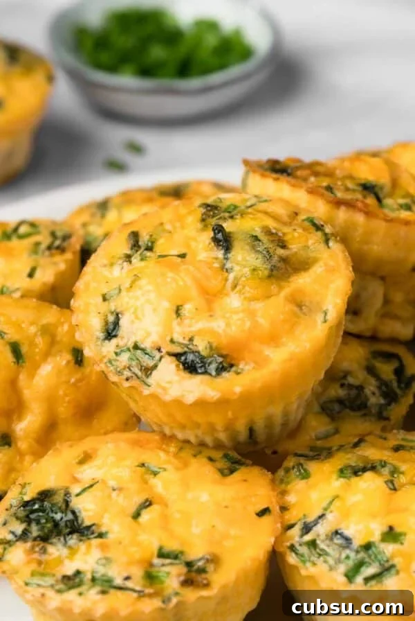 Make-Ahead Breakfast Burritos for Busy Mornings 12 side view of a pile of high protein egg muffins.