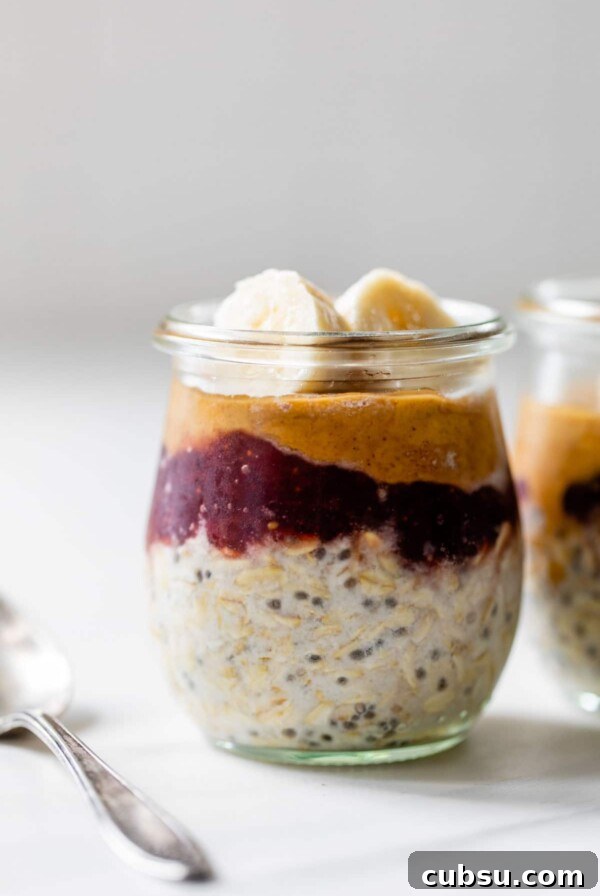 Make-Ahead Breakfast Burritos for Busy Mornings 13 a little jar with oats, peanut butter and jelly and topped with slices of banana