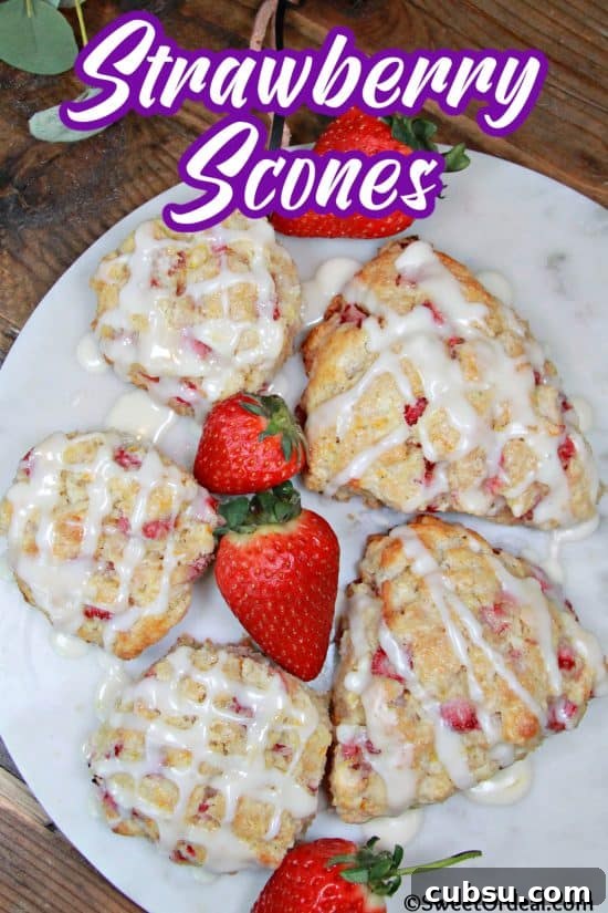 Flaky Strawberry Scones Recipe for Homemade Brunch 8 Round and pie shaped scones made with fresh strawberries, topped with an orange glaze for added sweetness.