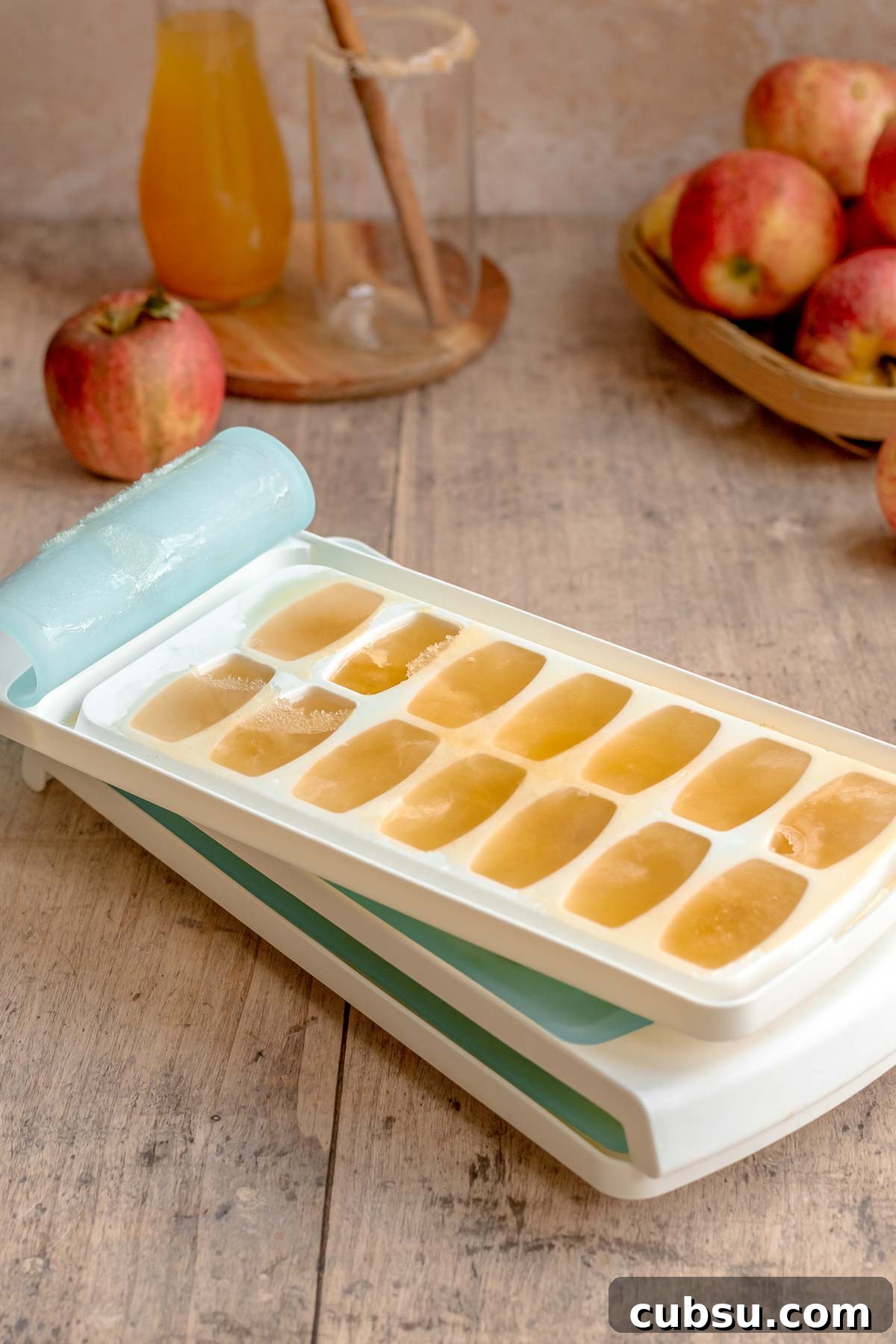 Spiced Apple Cider Slushies — Boozy or Virgin Recipes for Fall 4 Apple cider frozen in ice cube trays.