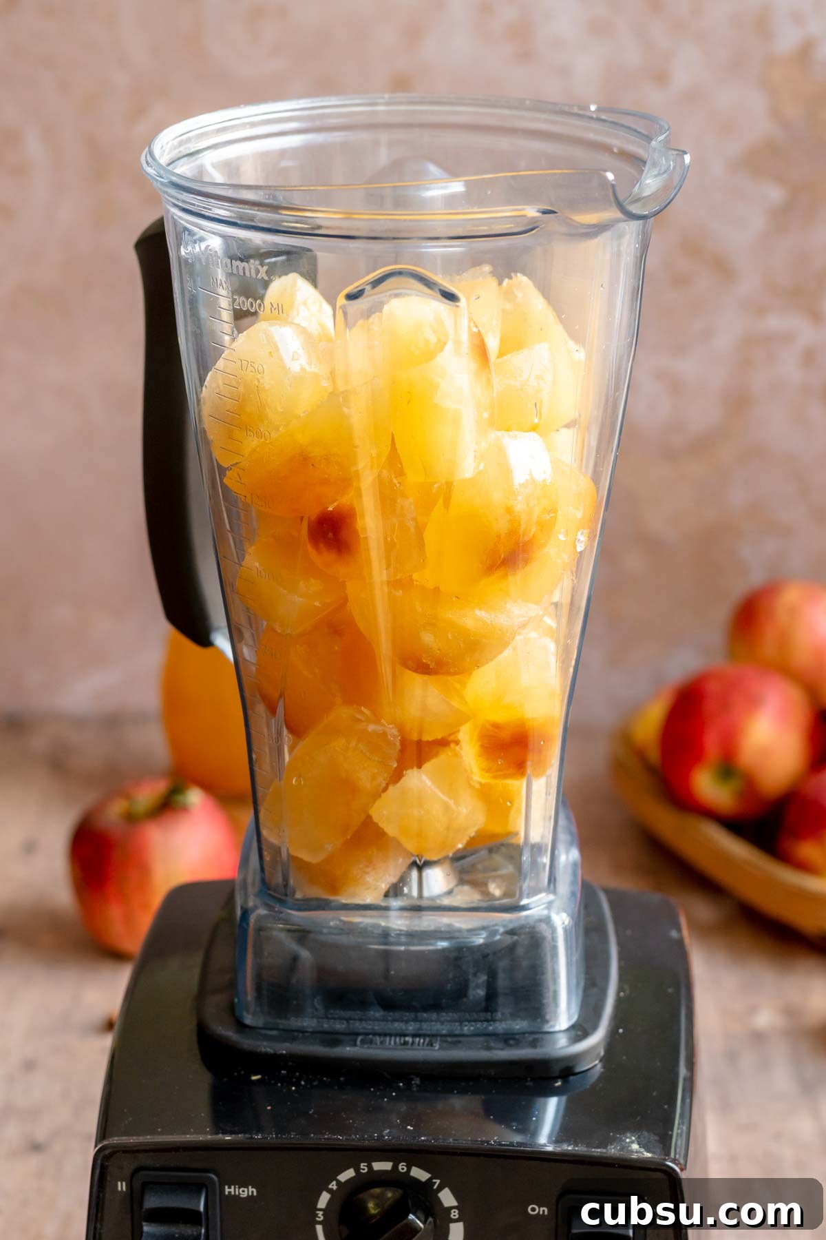 Spiced Apple Cider Slushies — Boozy or Virgin Recipes for Fall 7 Apple cider ice cubes in a blender.