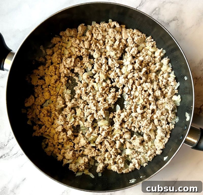 Skillet Egg Roll Bowls with Ground Pork and Veggies 4 Cooked ground turkey with onions, garlic, and ginger.
