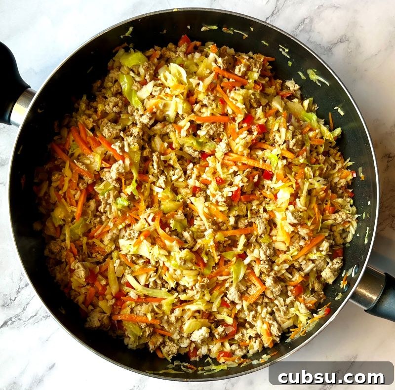 Skillet Egg Roll Bowls with Ground Pork and Veggies 6 Cooked carrots and cabbage with ground turkey.