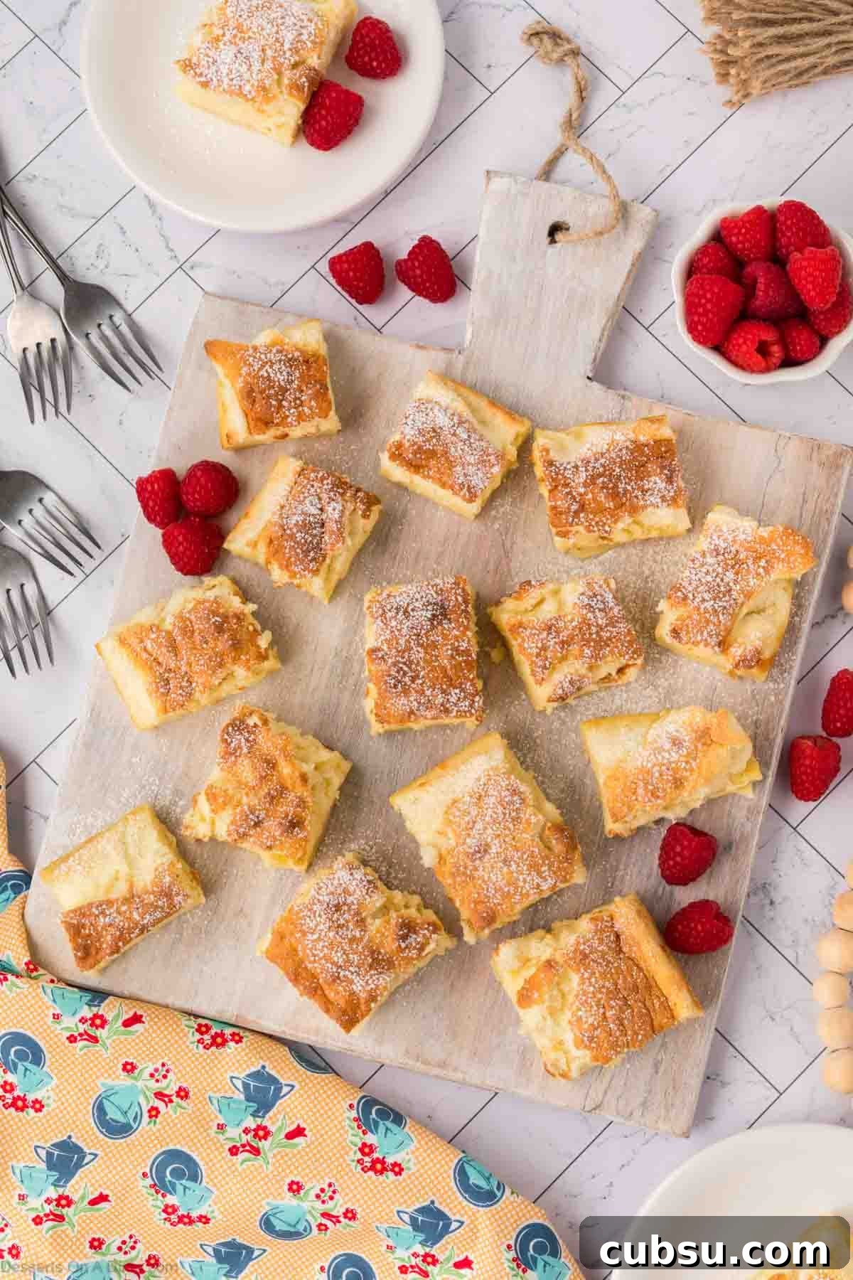 Make-Ahead Magic Cake Recipe: Fluffy Three-Ingredient Sponge 12 Magic Cake cut into squares.