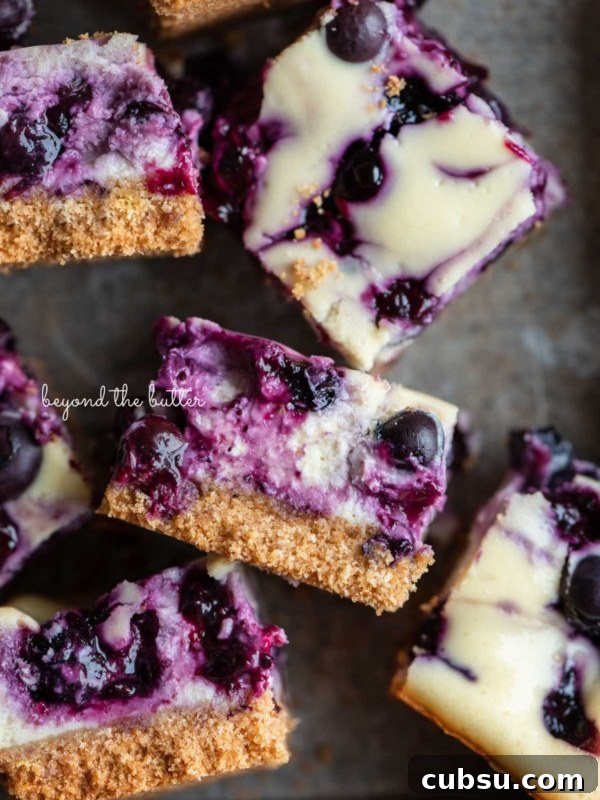 7-Layer Magic Cookie Bars Recipe: Simple Crowd-Pleaser 11 Sliced blueberry swirl cheesecake bars in a vintage baking tin