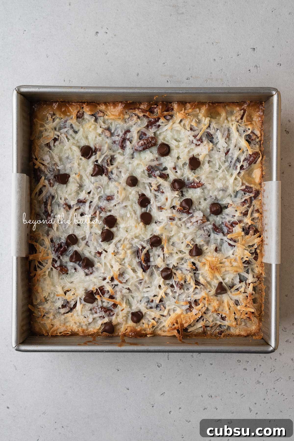 7-Layer Magic Cookie Bars Recipe: Simple Crowd-Pleaser 4 Just baked 7 layer magic cookie bars in 8 inch baking pan