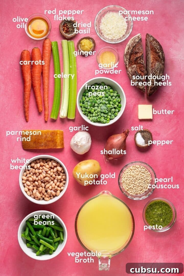 Overhead view of labeled ingredients for springtime minestrone soup including carrots, celery, peas, white beans, couscous, pesto and vegetable broth