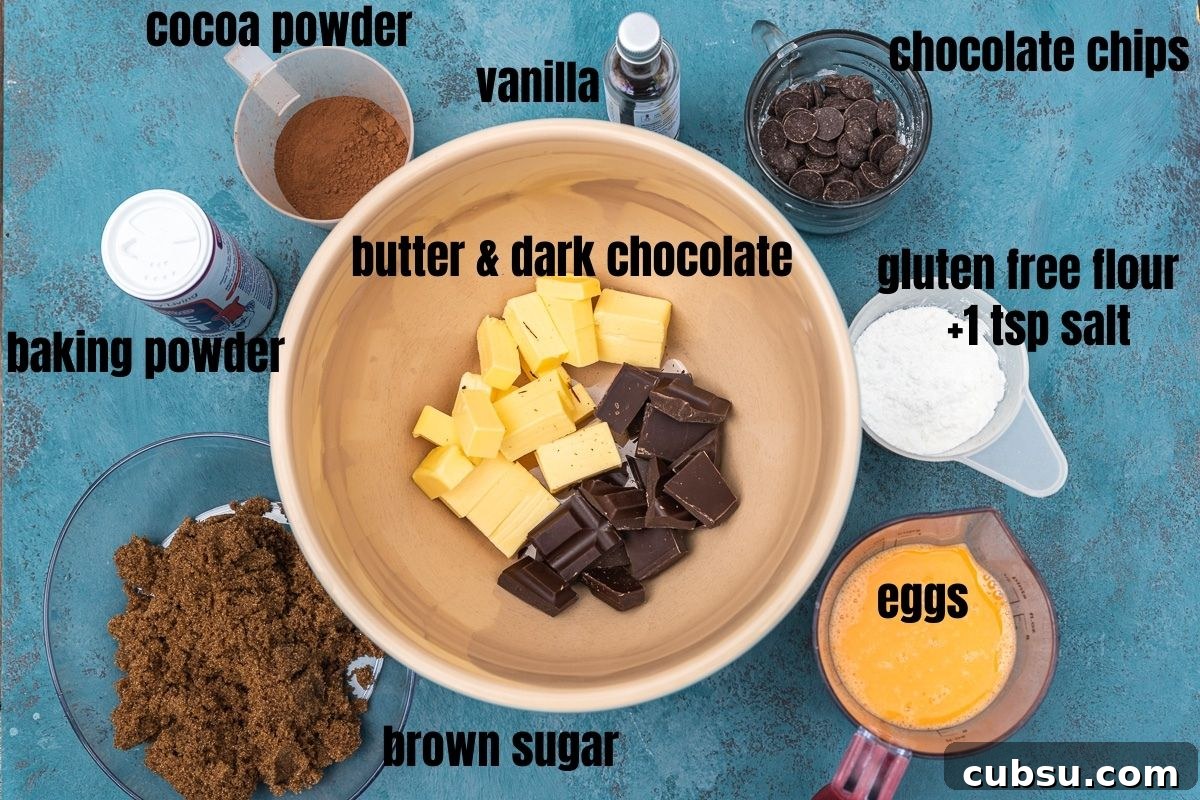One-Bowl Gluten-Free Brownies: Fudgy Recipe for Chocolate Lovers 3 Overhead photo of the ingredients in gluten-free brownies including butter & dark chocolate, brown sugar, cocoa powder, baking powder, vanilla, chocolate chips, gluten-free flour and eggs