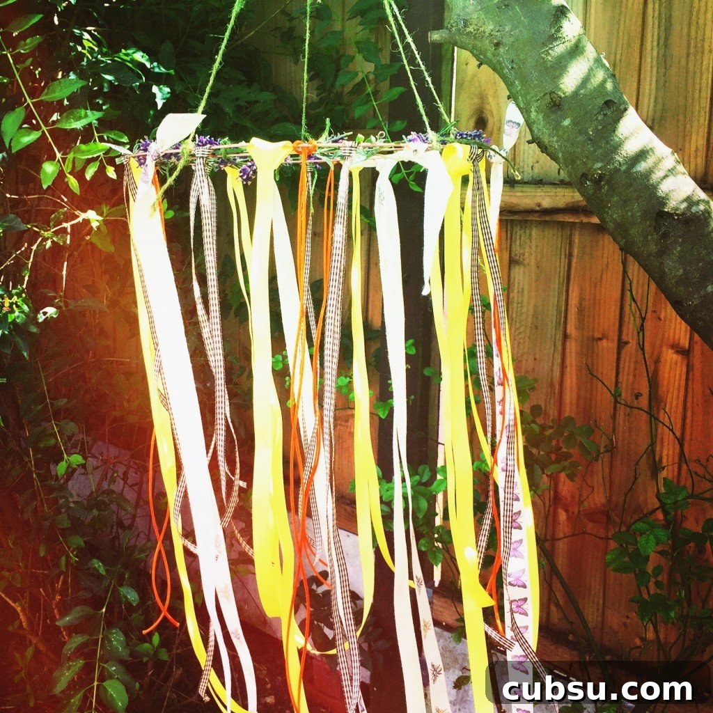Fun Spring Activities for Kids: Outdoor Crafts, Games & Ideas 4 make wind catchers, kids wind catchers, how to make wind catchers, easy garden party decorations, summer nature crafts for kids, ribbon wind catchers,