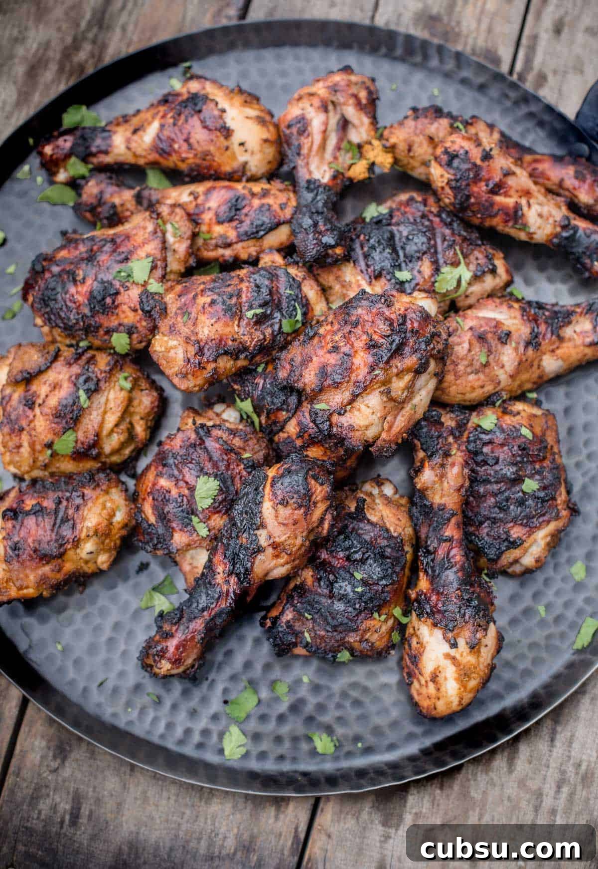 Pieces of grilled Jerk Chicken on a platter