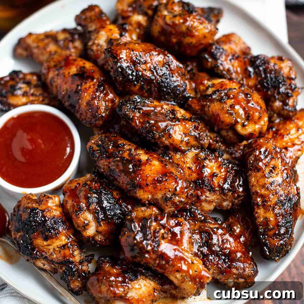 grilled chicken wings on a plate.