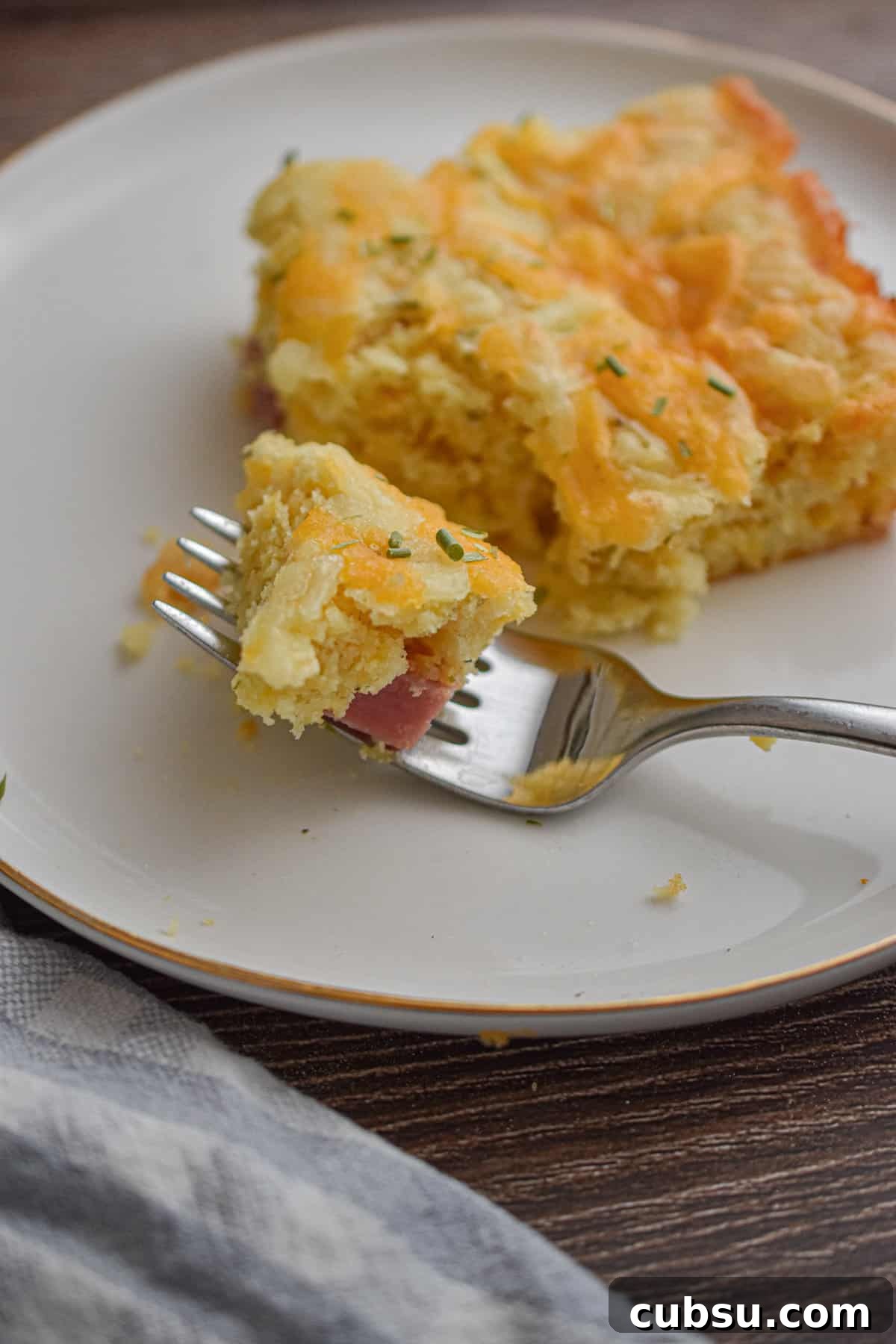 The texture of the Bisquick Breakfast Casserole is on a fork.
