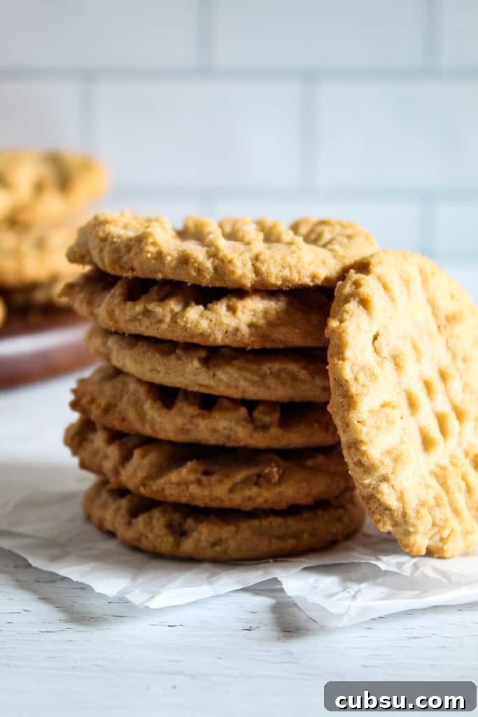 Gluten-Free Peanut Butter Cookies Recipe You’ll Love 2 stack of peanut butter cookies.