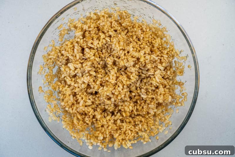 5-Ingredient Rice Krispie Treats Made Without Marshmallows 5 Mixing the rice krispies with the syrup