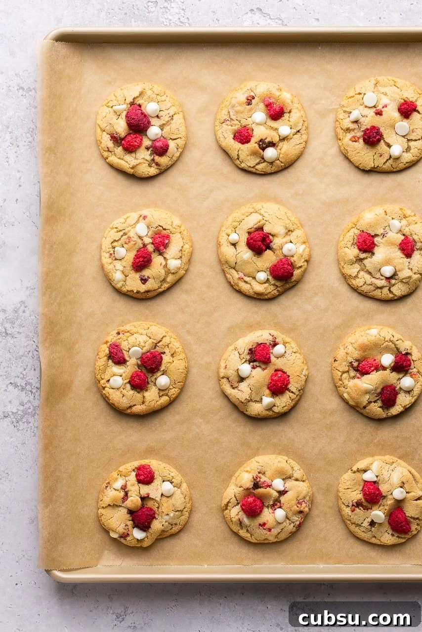 white chocolate raspberry cookies on a baking sheet