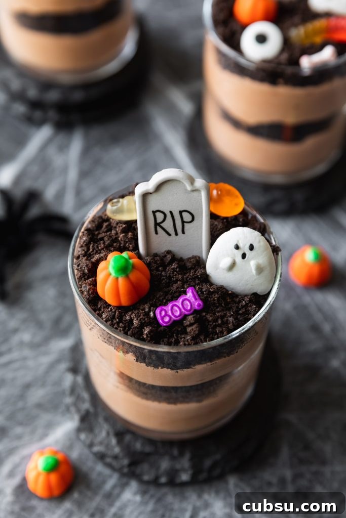 Spooky Halloween Dirt Cups Recipe for Kids and Parties 4 chocolate pudding cups decorated into graveyards