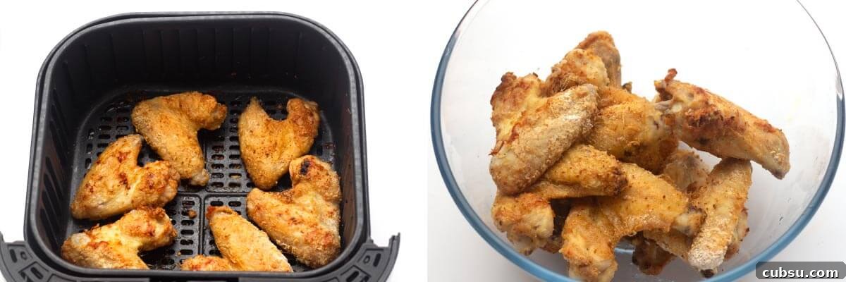 Crispy Buffalo Chicken Wings in the Air Fryer (Quick Recipe) 8 cooked wings in air fryer basket, cooked wings in bowl