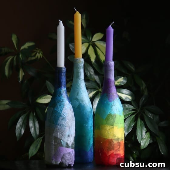 3 wine bottles with candles