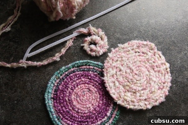 purple/blue trivet, pink coaster, pipe cleaners wrapped in yarn