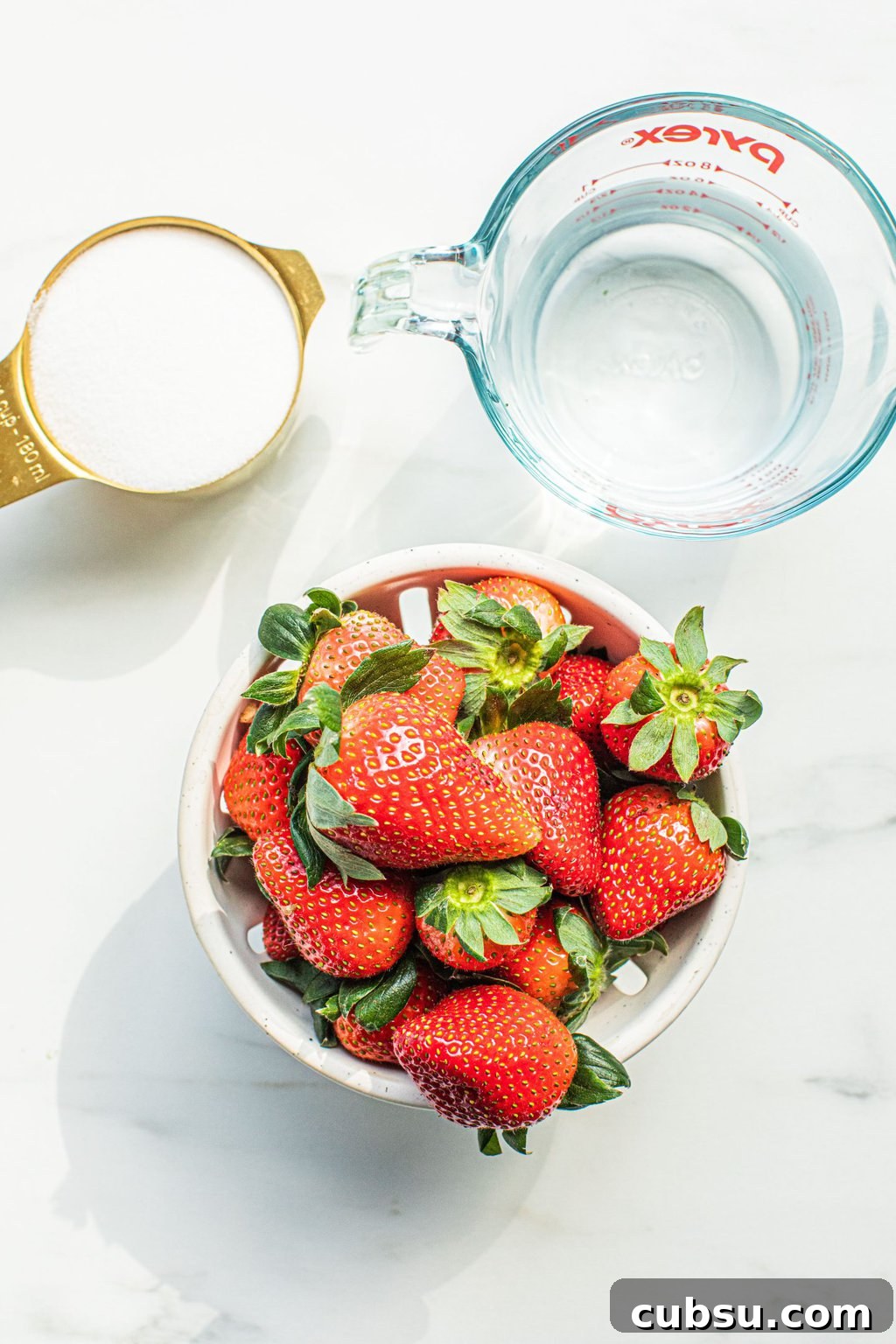 Homemade Strawberry Syrup Recipe for Cocktails and Mixers 3 strawberries, sugar, and water