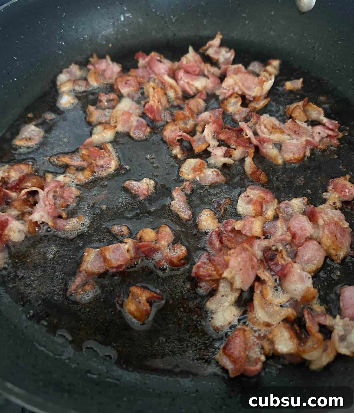 Savory Bacon and Cheese Muffins for Brunch or Snacks 4 Crispy bacon in skillet.
