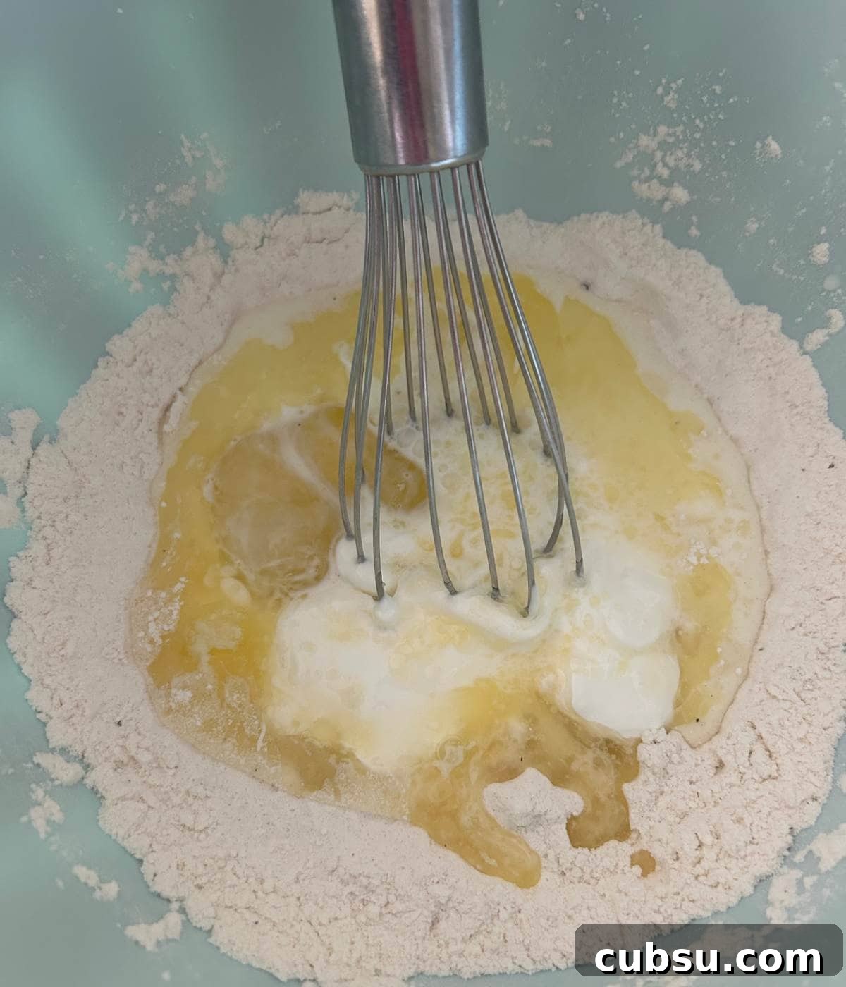 Savory Bacon and Cheese Muffins for Brunch or Snacks 5 Dry ingredients with wet ingredients and whisk.