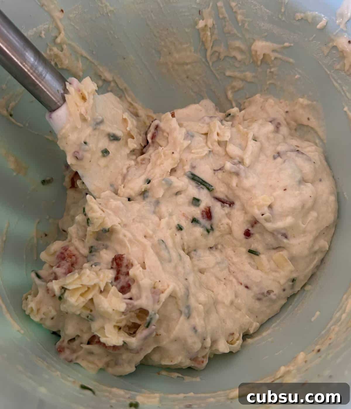 Savory Bacon and Cheese Muffins for Brunch or Snacks 7 Muffin batter with bacon, cheese and chives.