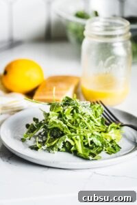 arugula salad with lemon vinaigrette on plate vertical