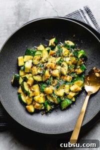 simple sauteed zucchini in a bowl overhead